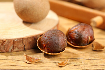 Longan Fruit Flesh with Cinnamon Sticks on Wooden Background - Exotic Asian Tropical Food...