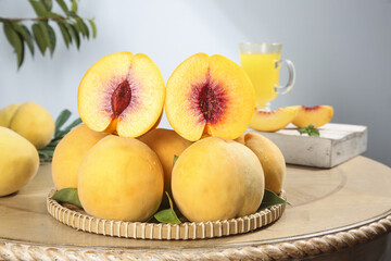 Fresh Yellow Peaches on Bamboo Tray with Juice Glass - Healthy Fruit Still Life
