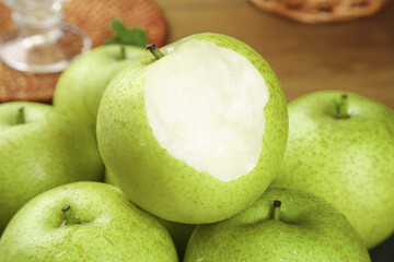 Fresh Green Dangshan Pears Display with Cut Pear Showing White Flesh Crown