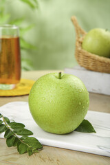 Fresh Green Pear with Water Droplets on White Plate - Healthy Fruit Display