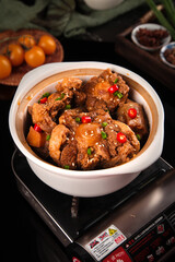 Spicy Braised Oxtail Stew with Beef Bones and Vegetables in White Bowl on Stovetop