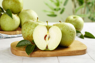 Fresh Green Apples from Shaanxi Province China on Wooden Cutting Board with Natural Lighting