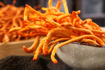 Traditional Chinese Cordyceps Medicinal Fungi in Ceramic Bowl - Premium Herbal Medicine Ingredients