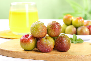 Fresh Ripe Plums with Water Droplets on Wooden Board - Healthy Summer Fruit Concept