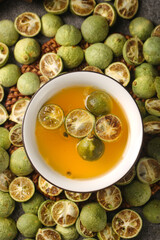 Kumquat Tea with Fresh Green Citrus Slices and Dried Fruit Arrangement
