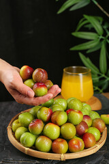 Fresh Colorful Plums in Wicker Basket with Orange Juice - Healthy Summer Fruit Still Life