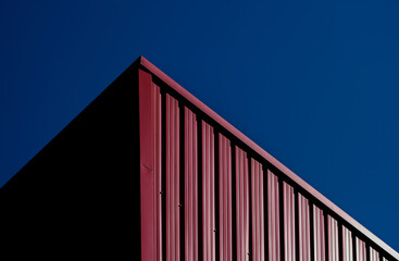 Modern architectural lines against deep blue sky