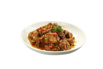 Deep Fried Pork Ribs with Spicy Sauce and Chili Peppers on White Plate