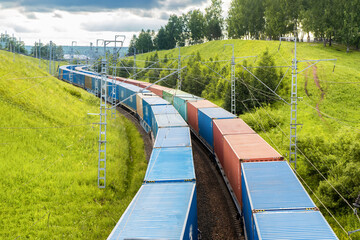 Railway container transportation . Two freight trains with containers are traveling in parallel...