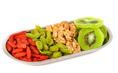 Gourmet dried fruits and nuts mix with walnuts, dates, kiwi and red berries healthy snack photography