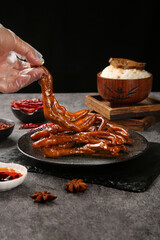 Marinated Duck Feet with Spices and Rice Bowl - Traditional Asian Cuisine Food Preparation