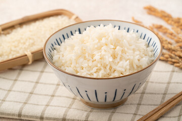 A cookd steamed white rice in a Traditional bowl.