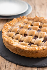 Traditional Pastafrola pie with guava filling, also known as Cuban pae on wooden table