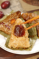 Sweet Chinese Rice Dumplings with Dates and Honey Filling Served with Chopsticks