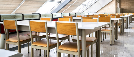 Wooden chairs in rows in interior architecture