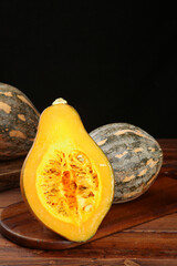 Farm Grown Winter Squash Cut in Half on Wooden Board Fresh Harvest Vegetables