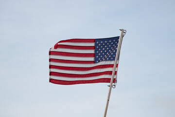 American flag waving with clear sky background
