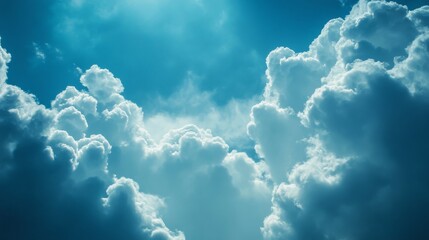 Fototapeta premium A bright blue sky with fluffy white clouds.