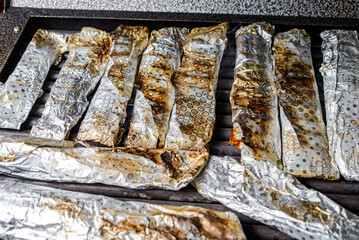 Grilled fish in aluminum foil