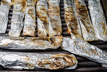 Grilled fish in aluminum foil