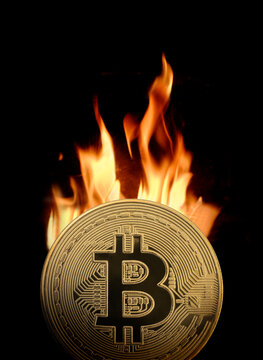 Golden Bitcoin burning in flames
