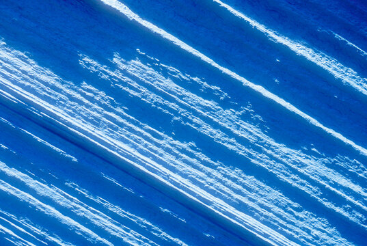 Rough textured barn wood painted blue