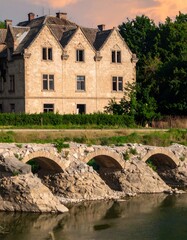 Old stone building by a river