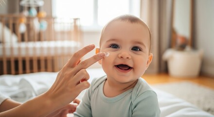 Skincare, baby and happy child with lotion on face for sensitive skin, dermatology and healthy wellness at home. Care, love and infant with smile and mother hand for protect, morning and family health