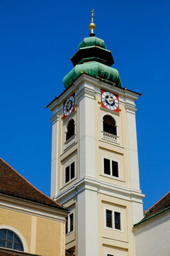 Clock tower of Schottenkirche against clear sky