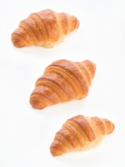 Freshly baked croissants on white surface food photography bakery minimalist setting artistic viewpoint