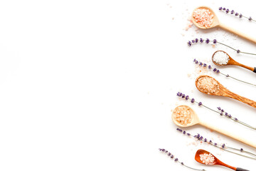 Fototapeta na wymiar Beauty spa therapy cosmetics and wellness flat lay - sea salt in many spoons with flowers, top view