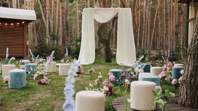 A beautiful venue for an outdoor wedding, the wedding ceremony is decorated with floral arrangements and elegant draperies for the perfect atmosphere