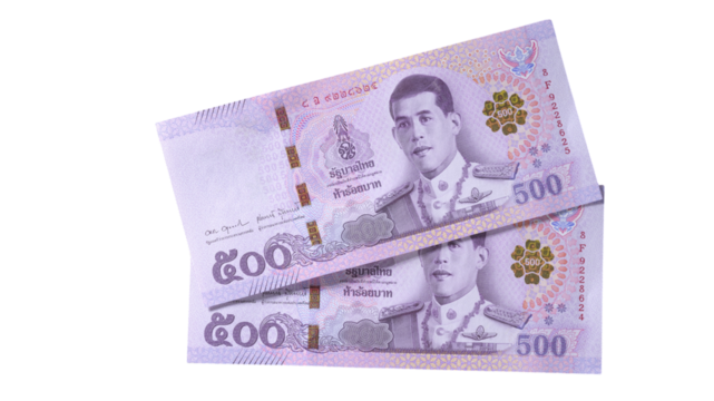 Hands counting banknotes in a dimly lit room showcasing cash currency exchange activity at night