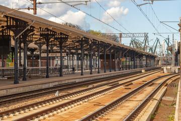 Historic Railway Platforms in Gdańsk with Cast-Iron Canopy Empty Train Station Platforms and Tracks, Gdańsk, Poland © Iliya Mitsk