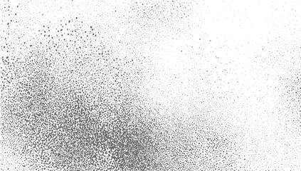 A white surface is covered with scattered gray dots of varying sizes and densities creating a textured pattern.