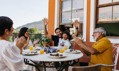 Family enjoying a lively Brazilian churrasco gathering outdoors