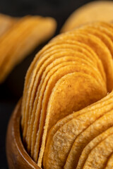 crispy potato chips fried in oil and sprinkled with dried red sweet pepper, a large number of delicious salty sweet pepper-flavored chips with aromatic spices