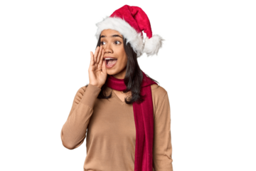 Filipino in Christmas attire and Santa hat shouting and holding palm near opened mouth.