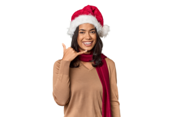 Filipino in Christmas attire and Santa hat showing a mobile phone call gesture with fingers.
