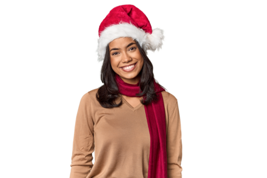 Filipino in Christmas attire and Santa hat happy, smiling and cheerful.