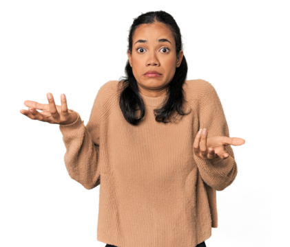 Young Filipina woman doubting and shrugging shoulders in questioning gesture. - Powered by Adobe