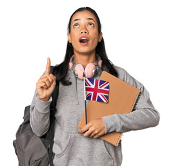 Young Filipino Erasmus student pointing upside with opened mouth.