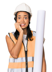 Young Filipino female architect biting fingernails, nervous and very anxious.