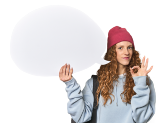Redhead holding a comic speech bubble cheerful and confident showing ok gesture.