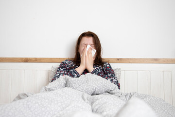 Sick child at home in bed. Acute respiratory viral infection.