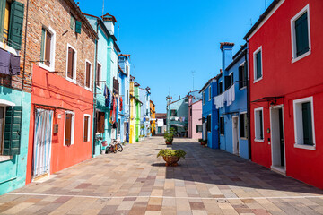 Colorful houses in a canal street houses of Burano island, Venice, Italy