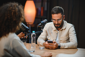 Podcasters creating engaging content in recording studio