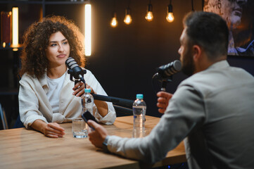 Content creators recording podcast in modern studio