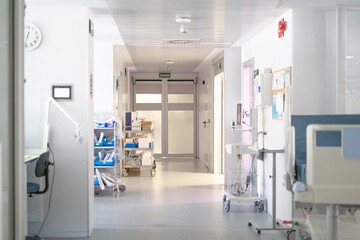 Empty hospital corridor with medical equipment and supplies