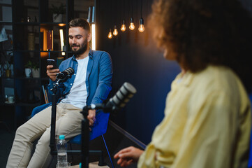 Content creators recording podcast in modern studio